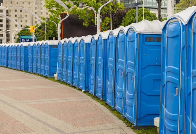 multiple portable restrooms in a neat and tidy row in Mabton, WA